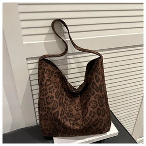Detail of leopard print tote bag with soft suede texture and large capacity