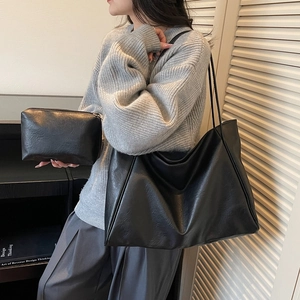 Minimalist black tote bag and clutch set in textured faux leather for daily fashion