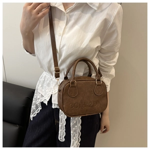 Brown retro bowling bag with COIH'2DN embossed text and adjustable crossbody strap