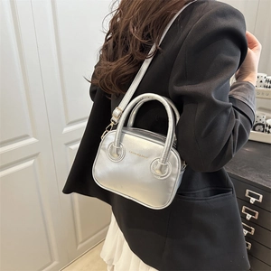 Chic silver metallic handbag for women with dual handles and adjustable shoulder strap