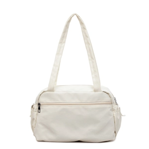 Minimalist cream canvas tote bag with front zipper pocket and spacious shoulder straps
