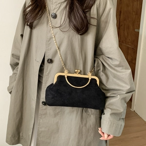 Classic black suede crossbody bag with ich rabbit embossing and gold metal clasp