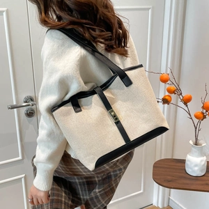 Retro canvas tote bag with black leather trim and gold buckle for daily commuting