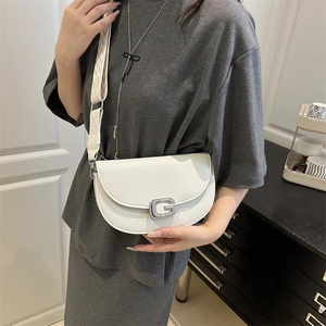 White minimalist saddle bag with litchi leather and geometric patterned wide strap