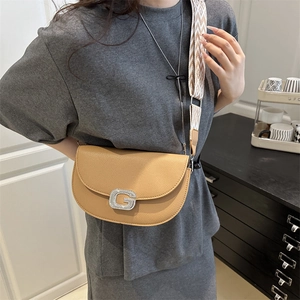Chic camel faux leather saddle bag with wide jacquard strap and G buckle detail