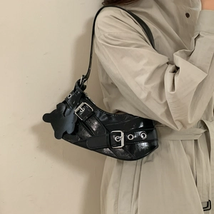 Minimalist black glossy leather shoulder bag with silver punk rivets and a star charm