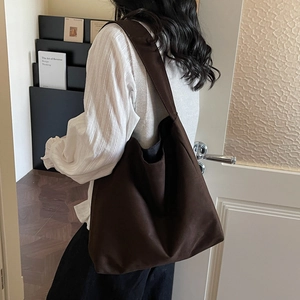 Minimalist large brown canvas tote bag for women showing spacious casual style