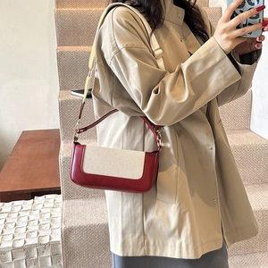 Vintage retro crossbody bag in contrast faux leather and canvas worn by a model