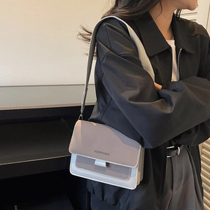Minimalist square crossbody bag with grey patchwork design and wide fabric strap