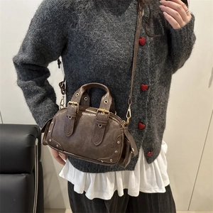 Vintage brown leather bowling bag with gold studs and adjustable shoulder strap