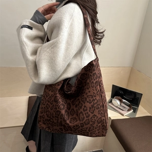 Large capacity leopard print canvas tote bag styled as a shoulder bag for casual commute