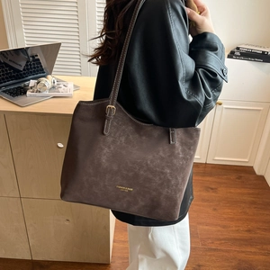 Retro dark brown large tote bag with contrast stitching and adjustable gold buckle