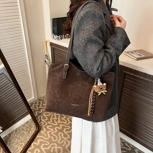 Retro dark brown large tote bag with teddy bear charm and fringe accessory