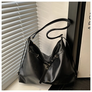 Detailed macro view showing soft matte PU leather texture and metal eyelet decor of tote bag