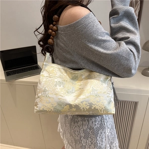 Chic beige jacquard shoulder bag with traditional landscape motifs and wooden bead handle