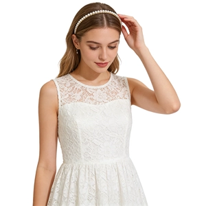 Elegant gold metal headband with white pearls shown on model with clean white background