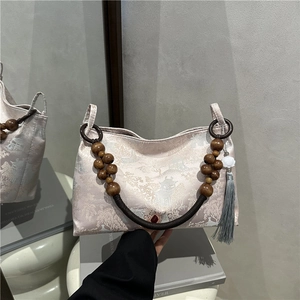 Elegant Chinese style jacquard tote bag with wooden bead handle and long tassel charm