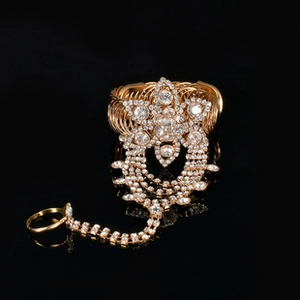Exquisite gold hand harness with white rhinestones and large star flower centerpiece
