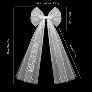 White tulle bridal bow hair clip with pearls and Bride to be text for party