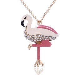 Detail of flamingo pendant with pink enamel and sparkling rhinestones on gold chain