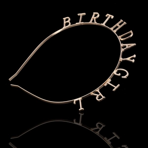Detailed view of the gold metallic Birthday Girl headband with a reflective mirror base