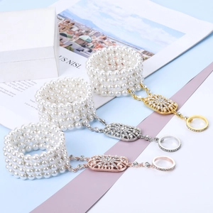 Three-piece pearl slave bracelet set in gold, silver, and rose gold with rhinestones