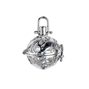 Detailed close-up of a silver hollowed-out spherical locket with intricate vine carvings