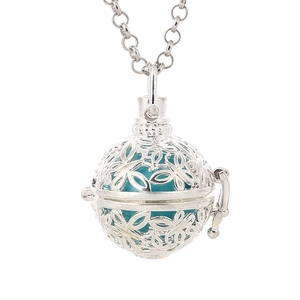 Vintage hollow butterfly harmony ball pendant necklace with turquoise bead on white background