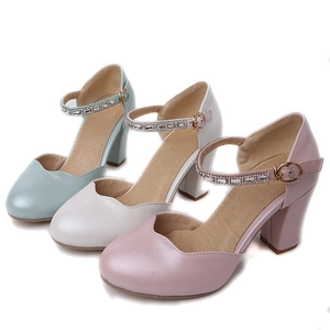 Detail of elegant chunky heel Mary Jane shoes with rhinestone straps and embossed insoles