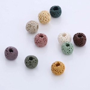 Macro shot of colorful porous lava stone diffuser beads with central holes for jewelry DIY