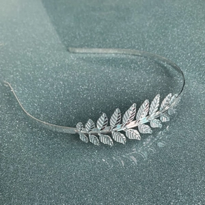 Elegant silver leaf headband crown with detailed branch design for weddings and brides