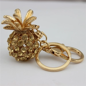 Golden crystal pineapple keychain with amber rhinestones and swivel lobster clasp