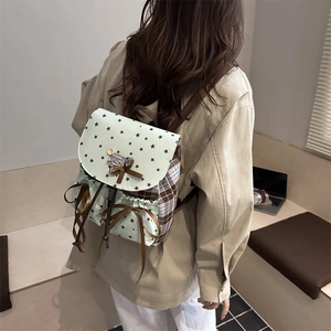 Women's mini backpack in light green with star patterns and brown plaid accents