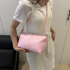 Minimalist pink PU leather shoulder bag with decorative knot strap and rectangular design