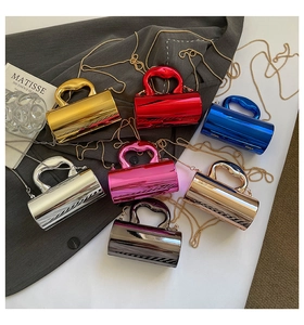 Detailed top view of cylinder acrylic crossbody bags in seven glossy metallic colors