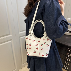 White cherry print shoulder bag with silver ring handle and adjustable strap for women