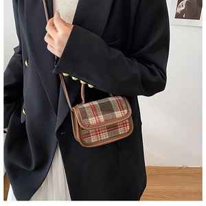 Toddler girl mini plaid crossbody bag styled with a black blazer and pleated skirt