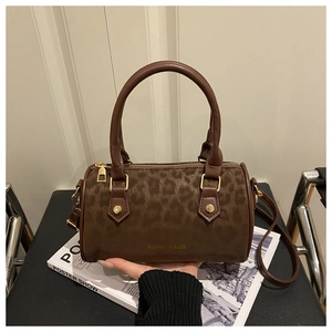 Detail of leopard print boston bag with gold rivets and FASHION & BAGS gold logo