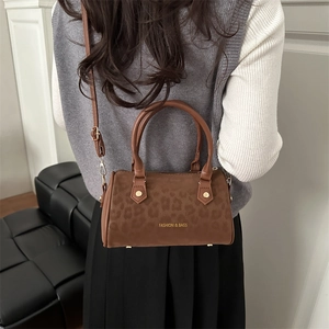 Stylish brown leopard print cylinder handbag and crossbody bag with fashion text