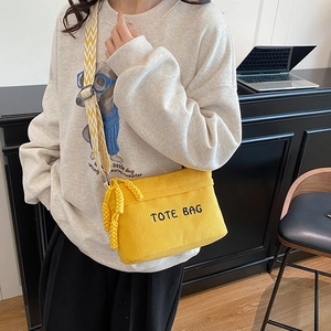 Yellow corduroy crossbody tote bag with TOTE BAG embroidery and woven tassel strap