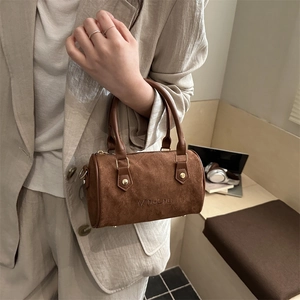 Brown frosted suede Boston handbag with vintage cylinder design and dual handles for women