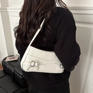 Chic white shoulder bag with decorative bow and silver ring detail for women