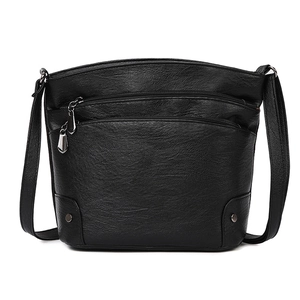 Chic black pebbled leather bucket bag with silver zipper pockets and shoulder strap