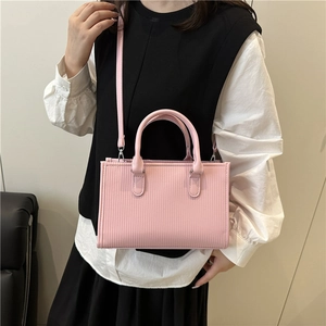 Pink textured leather mini tote bag for women with dual handles and crossbody strap