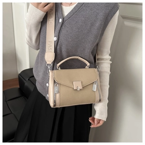 Detail of canvas and leather crossbody bag with jacquard classic fashion strap