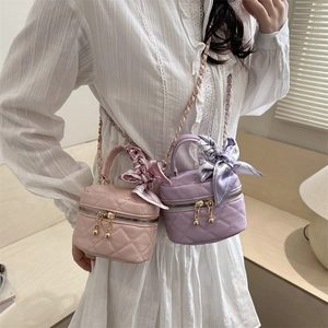 Quilted mini crossbody bags in pink and purple with chain strap and scarf decor