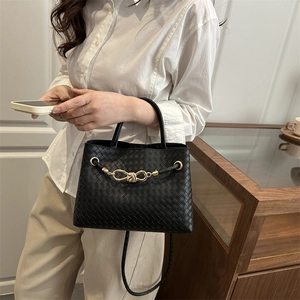 Large capacity black woven leather handbag with gold knot detail and shoulder strap