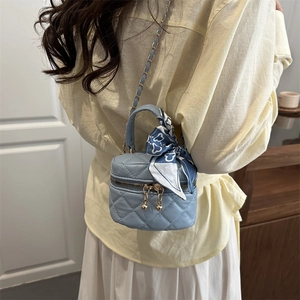 Mini light blue quilted vanity case with floral scarf handle and gold chain strap