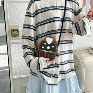 Chic cupcake-shaped crossbody bag with black polka dots and white heart detail for women