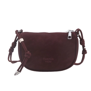 Retro burgundy semi-circular crossbody bag with knotted shoulder strap and silver accents